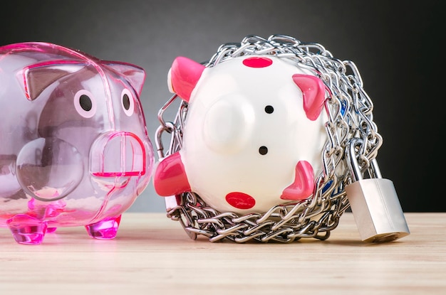 A visually appealing piggy bank with dollar bills and coins beside it, set against a background of a family. The image emphasizes the importance of saving and creating an emergency fund for unexpected medical expenses.
