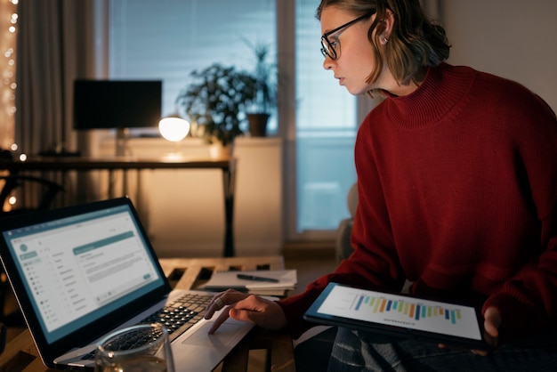 A person analyzing a budget spreadsheet on a laptop, with graphs and financial charts visible on the screen. It illustrates the concept of financial planning and budgeting for unexpected medical bills.