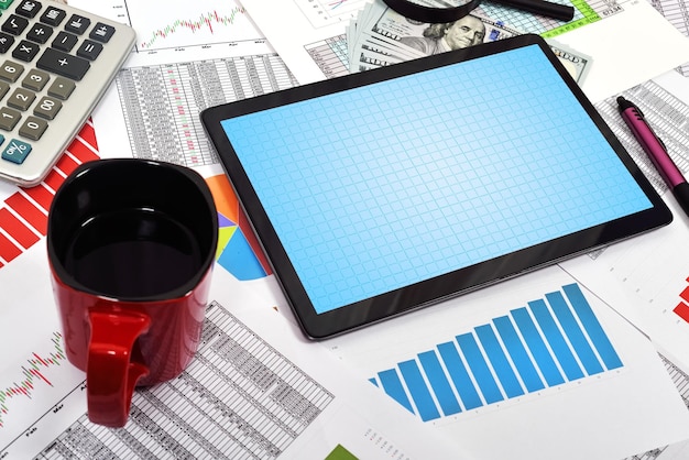 A spreadsheet application on a laptop displaying various financial metrics such as ROI, annual growth rate, and portfolio diversification for tracking investment performance.