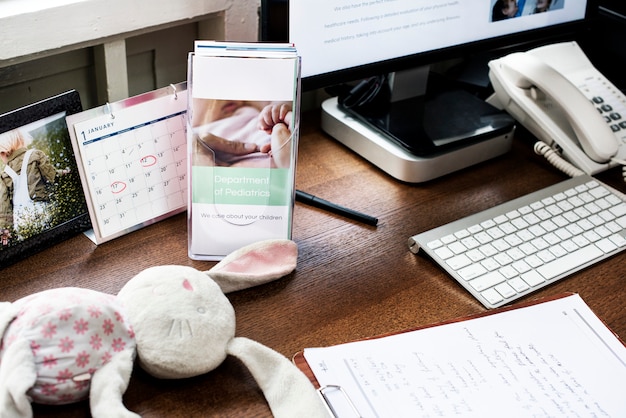 A neatly organized home office desk with a calculator, tax documents, and donation receipts spread out, symbolizing financial planning and charitable giving.
