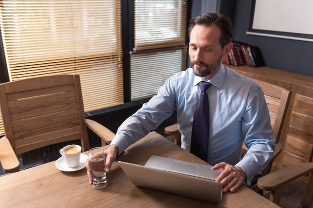A professional tax advisor sitting across a desk from a small business owner, discussing financial statements and tax implications.