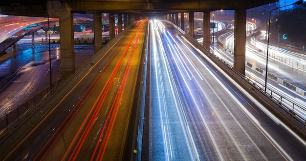 A high-speed train speeding along a modern track, showcasing advancements in public transportation infrastructure. The image should evoke efficiency, connectivity, and modernization.